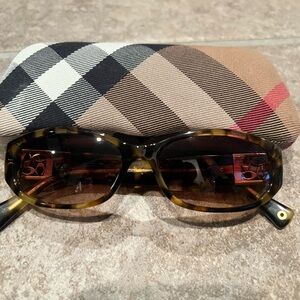Coach tortoise frame sunglasses and Burberry case.